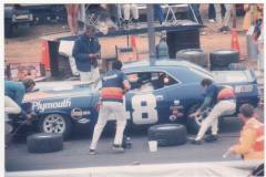 Dan Gurney getting tires and gas.