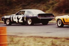 Swede Savage holding off a Mustang
